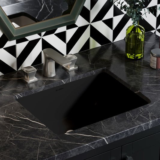 18.5" undermount rectangular bathroom sink in matte black with black marble countertop and silver faucet.