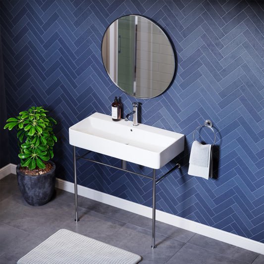 36-inch white ceramic console sink with chrome legs, rectangular basin, single faucet hole.