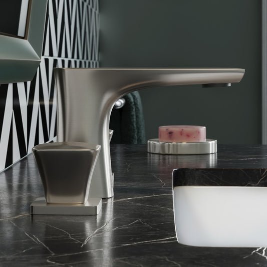 Widespread bathroom faucet in brushed nickel with two handles and a sleek modern design.