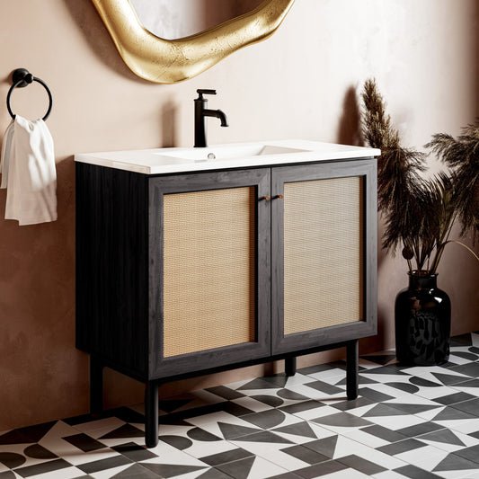 36-inch freestanding bathroom vanity in black oak with white sink top and black single-handle faucet.